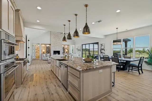Kitchen island with counter seating and the dining area beside it